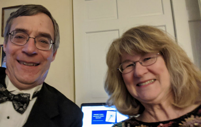 A selfie of a couple in formal attire