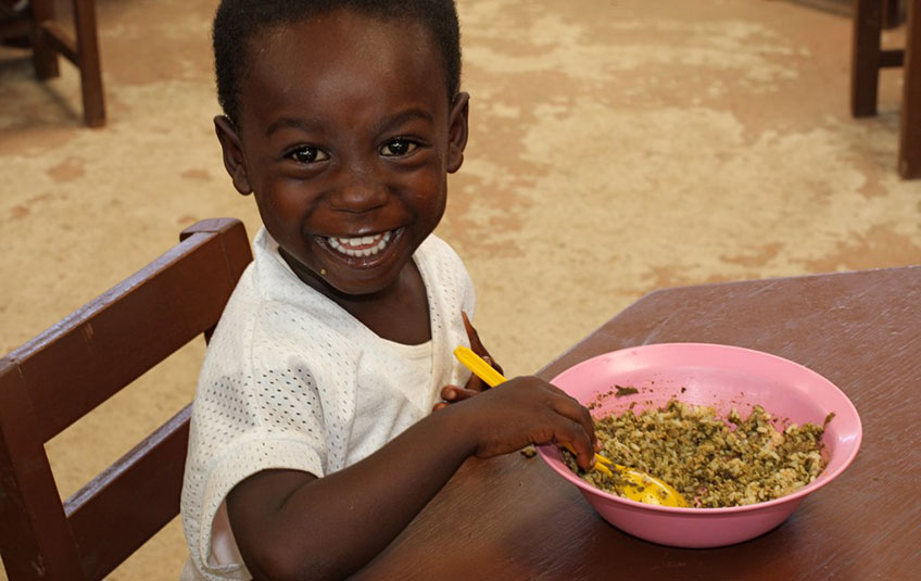 a young boy eats FMSC food