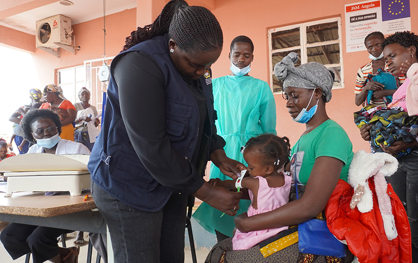 A girl in Angola getting a medical checkup