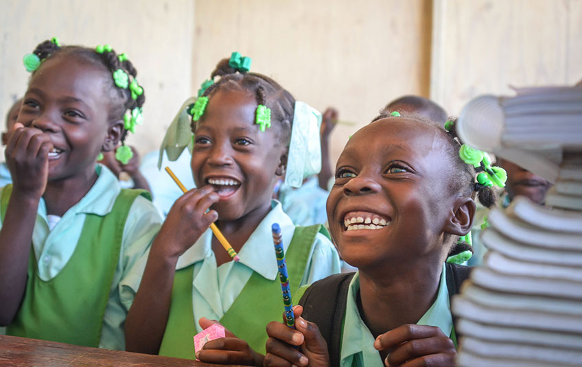 Kids eating school meals in Haiti