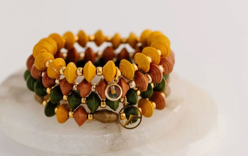 Bracelet stack of 4 with mustard seed and mountain charms, yellow, orange, green and gold paper beads