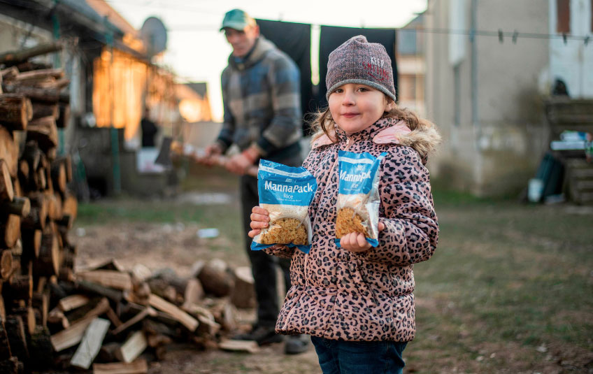 A Ukrainian girl holding FMSC food