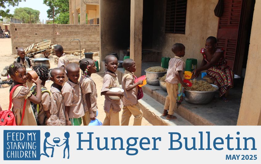 Kids receiving FMSC food in Burkina Faso. 