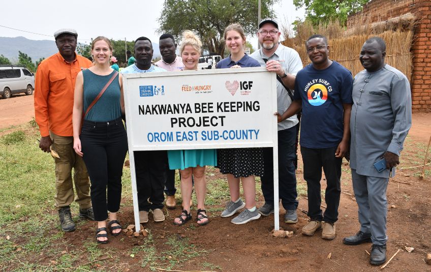 FMSC staff and community leaders at the Nakwanya Bee Keeping Project in Uganda. 
