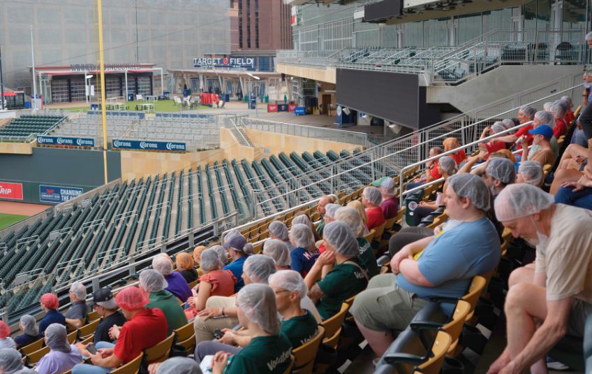People wearing hairnets in the stands of Target Field
