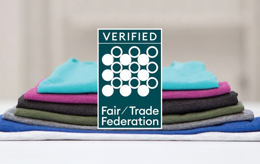 FMSC MarketPlace Fair Trade Federation Verified mark with stack of fabric