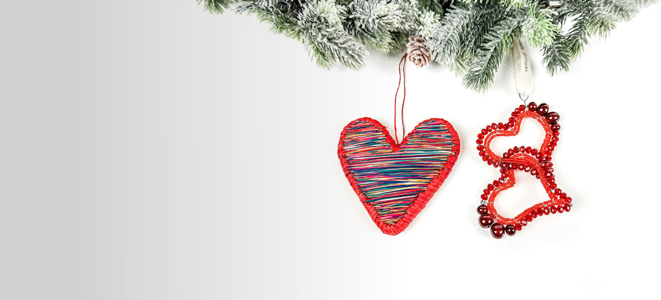 three heart-shaped Christmas ornaments