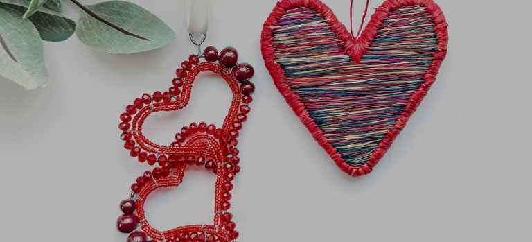 three heart-shaped Christmas ornaments